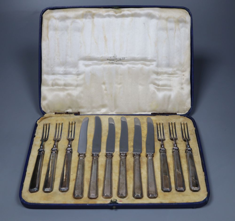 A cased set of six pairs of George V silver handled dessert eaters, Mappin & Webb, Sheffield 1934.